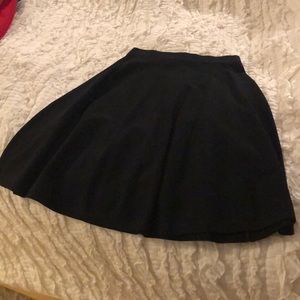 Black spandex/knit flowy mini skirt
